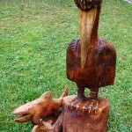 Pelican and fish - sculpture made through chainsaw wood carving